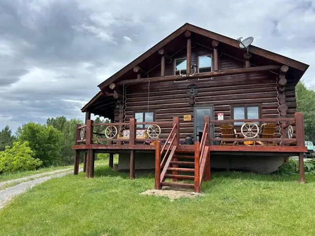 Log home on a knoll with almost 40 acres in three tracts